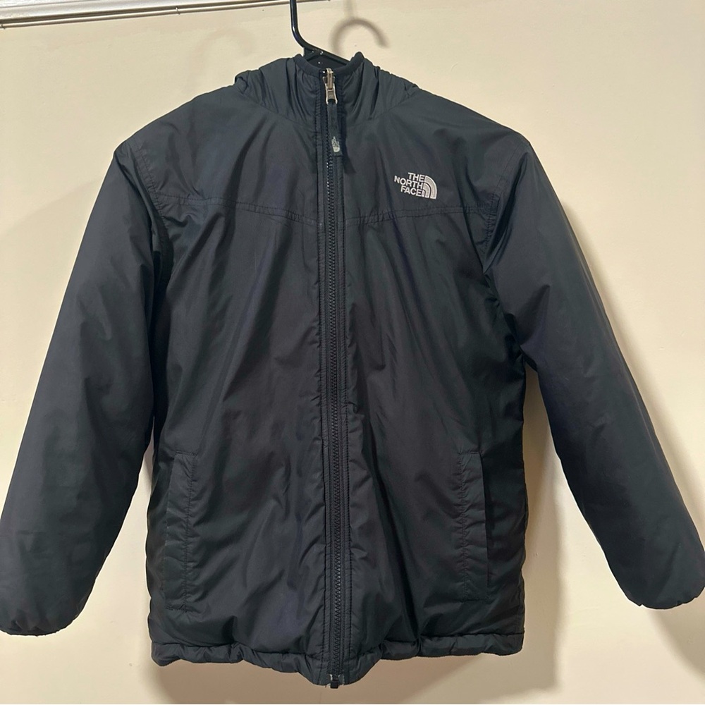 Women’s Northface Jacket. Reversible. Small slit on one side as pictured. Size S